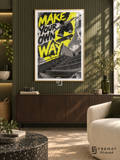 Make Your Own Way: A skateboarder jumps above concrete steps against acid-yellow and graphite graphics with a rough printed texture. Gold frame with a white printed border, displayed in a styled room.