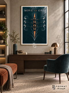 Move As One: An overhead rowing shell crosses dark petrol-colored water, surrounded by fine ripples and synchronized oars. Gold frame with a white printed border, displayed in a styled room.