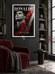 Cristiano Ronaldo: Cristiano Ronaldo appears in a monochrome portrait above a smaller red number-7 figure with outstretched arms, amid crimson and silver diagonals. Black frame with a white printed border, displayed in a styled room.