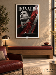 Cristiano Ronaldo: Cristiano Ronaldo appears in a monochrome portrait above a smaller red number-7 figure with outstretched arms, amid crimson and silver diagonals. Wooden Texture frame with a white printed border, displayed in a styled room.