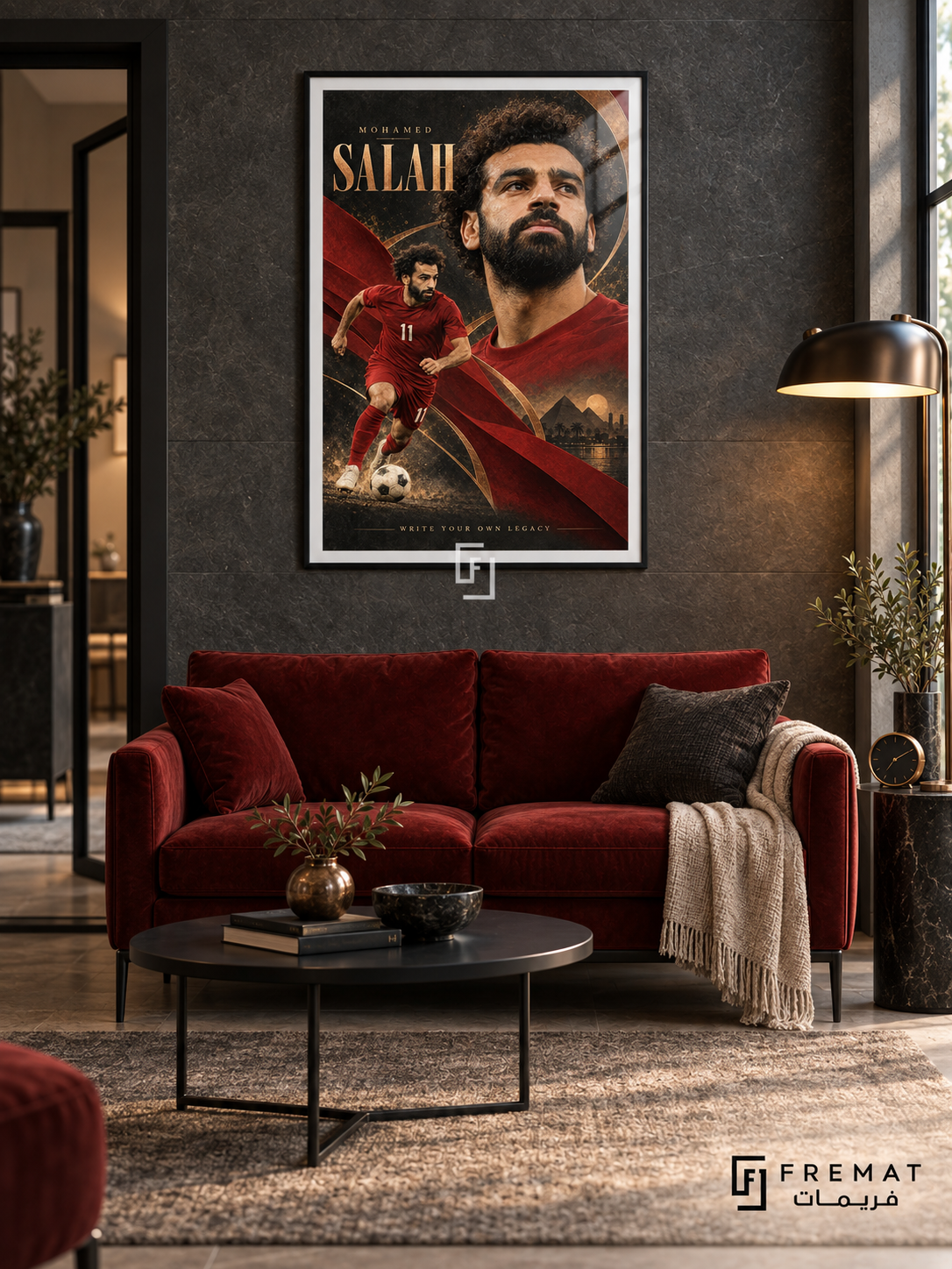 Mohamed Salah: Mohamed Salah appears in a warm portrait beside a smaller red number-11 football figure, with copper arcs and charcoal-and-gold textures. Black frame with a white printed border, displayed in a styled room.