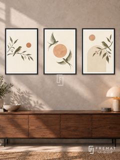 Quiet Wings — set of three complementary boho artworks in Black frames, shown at 50×70 cm each.