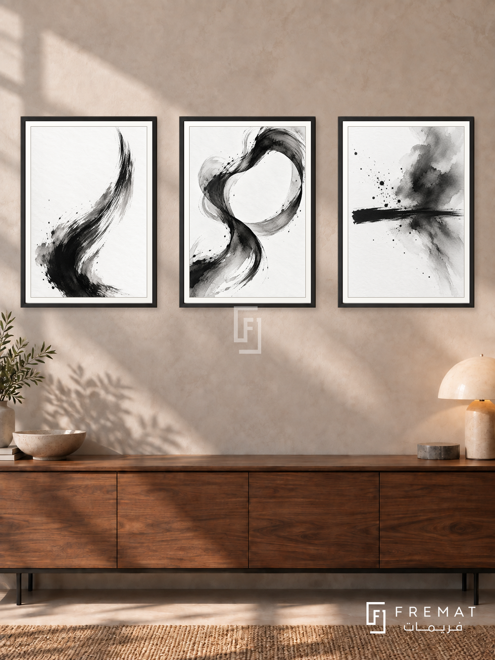 Ink In Motion — set of three complementary black and white artworks in Black frames, shown at 50×70 cm each.