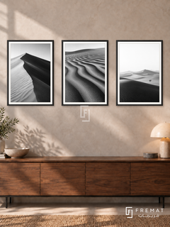 Desert Lines — set of three complementary black and white artworks in Black frames, shown at 50×70 cm each.