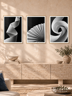 Paper Poetry — set of three complementary black and white artworks in Gold frames, shown at 50×70 cm each.