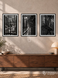 Urban Rain — set of three complementary black and white artworks in Black frames, shown at 50×70 cm each.