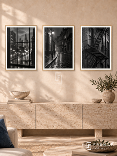 Urban Rain — set of three complementary black and white artworks in Gold frames, shown at 50×70 cm each.