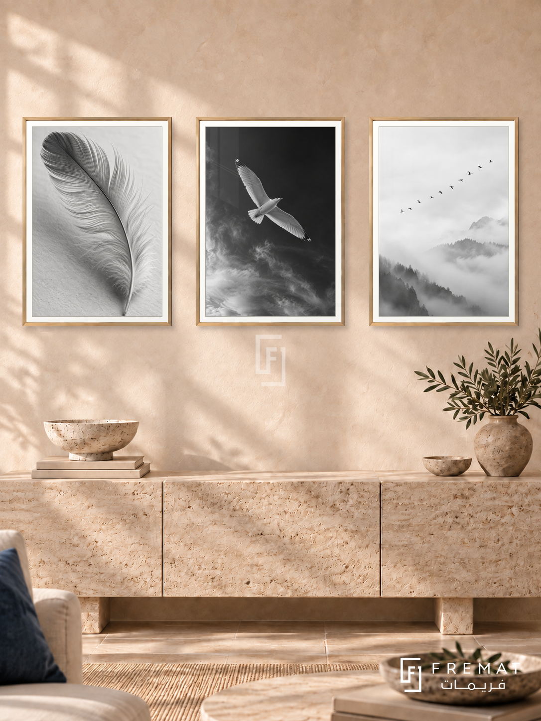 Feather And Flight — set of three complementary black and white artworks in Gold frames, shown at 50×70 cm each.