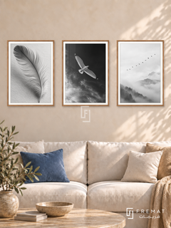 Feather And Flight — set of three complementary black and white artworks in Wooden Texture frames, shown at 50×70 cm each.