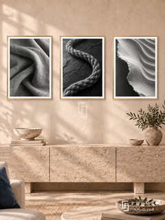 Woven Earth — set of three complementary black and white artworks in Gold frames, shown at 50×70 cm each.