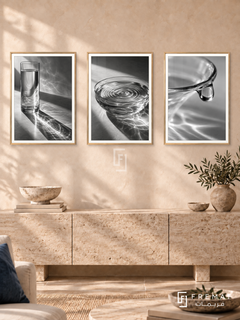 Glass And Water — set of three complementary black and white artworks in Gold frames, shown at 50×70 cm each.