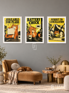 Battery — set of three complementary funny artworks in White frames, shown at 50×70 cm each.