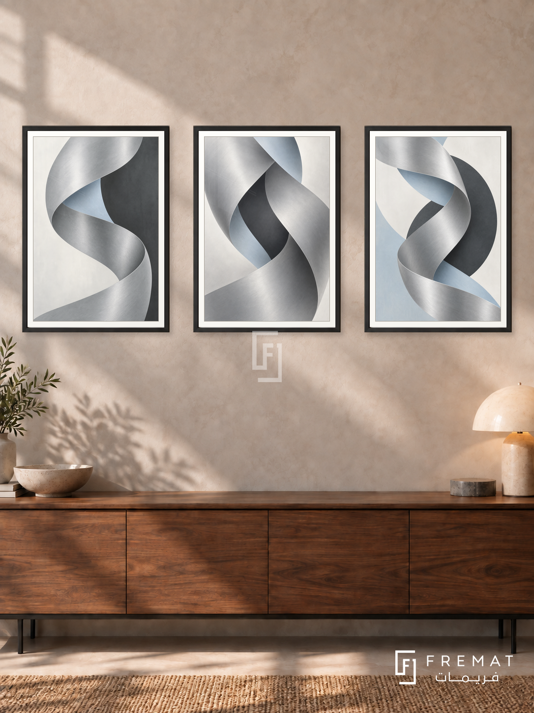 Quiet Chrome — set of three complementary modern abstract artworks in Black frames, shown at 50×70 cm each.