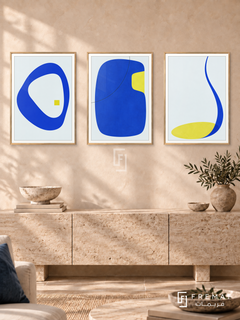 Electric Calm — set of three complementary modern abstract artworks in Gold frames, shown at 50×70 cm each.